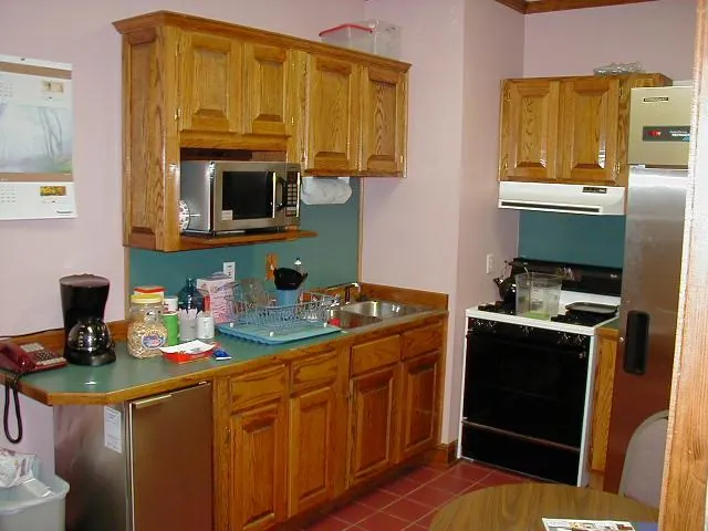 Kitchen with wood cabinets and appliances