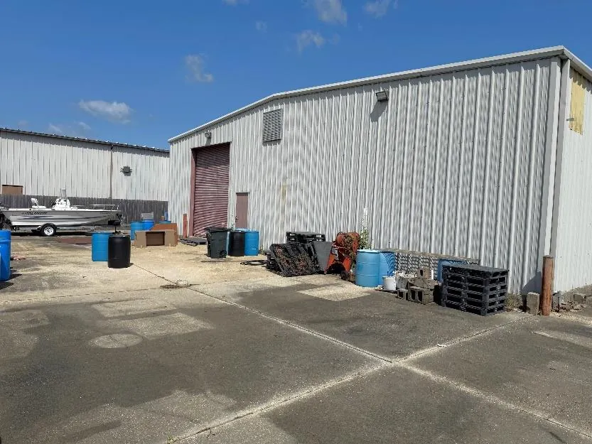 Concrete rear loading and storage area behind the building